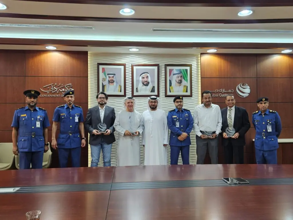 receiving a token of appreciation from Dubai Customs